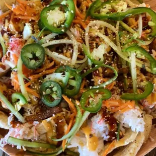 a plate of nachos on a wooden table
