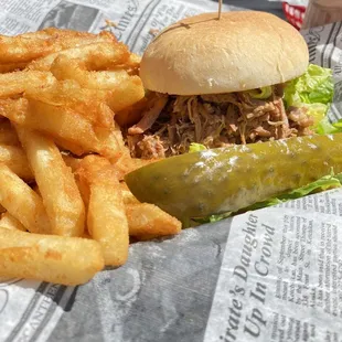 Kalua Pulled Pork Sandwich with fries and a sweet pickle