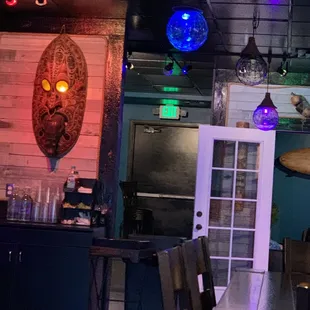 a table and chairs in a dimly lit room