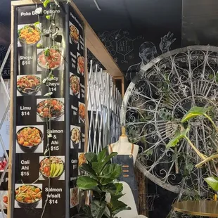 a restaurant with a menu on the wall