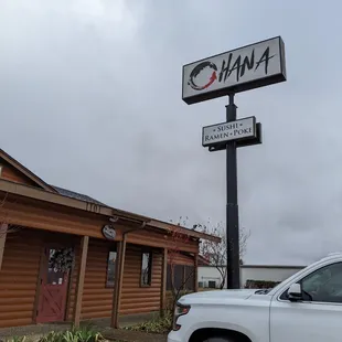 a white truck parked in front of a building