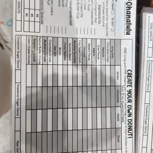 a close up of a person's hand holding a receipt