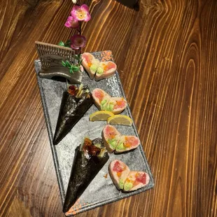 Eel hand roll and pink lady roll