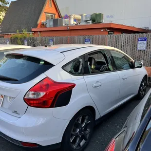 the rear end of a white car