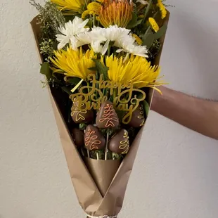 a person holding a bouquet of flowers