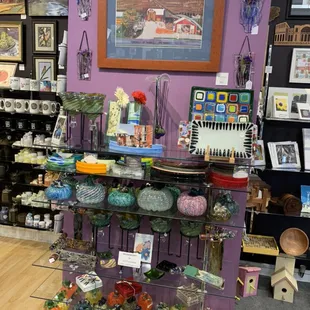 Picture frames, blown glass bowls and pumpkins.  One of a kind vases and Art.