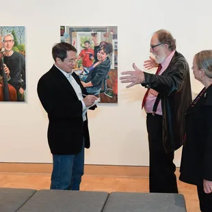 Artist sharing impressions with Dispatch writer Tim Feran.