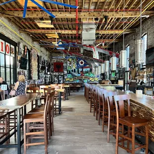 the inside of a restaurant with tables and chairs