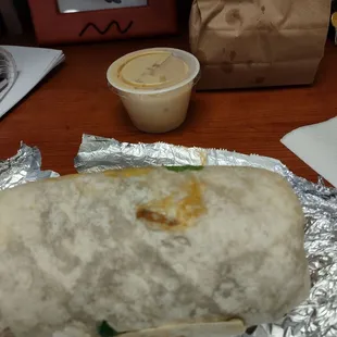 Burrito, queso and bag of chips