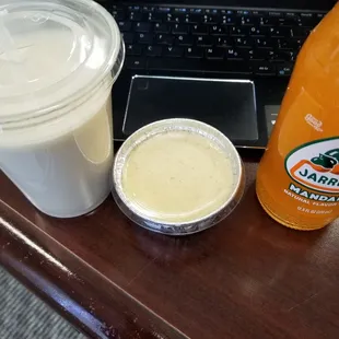 a laptop, a drink and a laptop