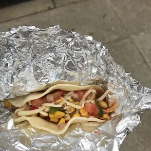 Taco de Mexicano with shredded chipotle chicken and corn salsa