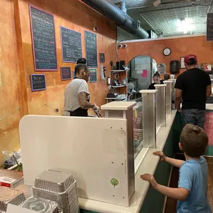 a man and a boy ordering food