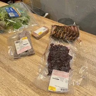 Pork pastrami, jerky, living arugula, ciccioli