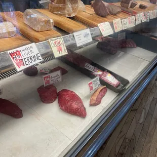 meat on display in a deli case