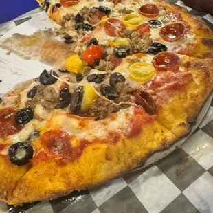 Build your own 10 inch pepperoni, black olives, tomatoes, sausage