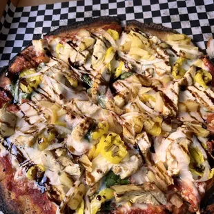 Cauliflower crust with no cheese but loaded with chicken, onion, artichoke hearts, wax peppers and a balsamic glaze. So good!