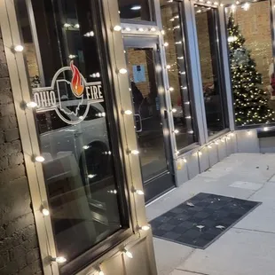 the front of a building with christmas lights