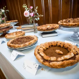 a variety of pies on a table