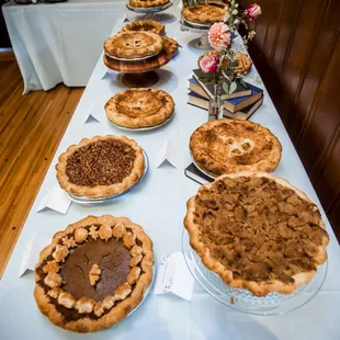 a long table of pies