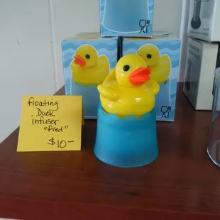 three rubber ducks in a bucket