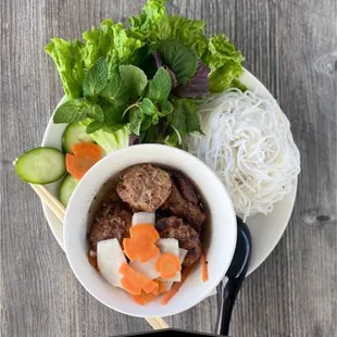 a bowl of beef and noodles