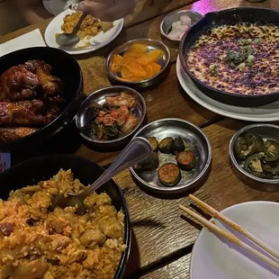 Corn cheese top right, kimchi fried rice in the bottom, Yangnyeom Wings in the top left corner