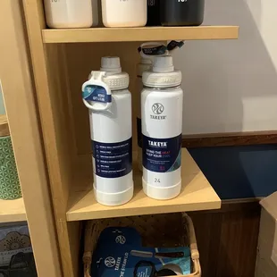 a shelf of coffee roasters