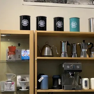 a shelf of coffee pots