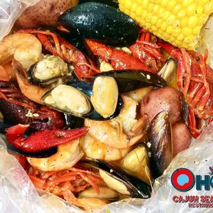 Seafood Boil Bag with Crawfish, Mussels, Shrimp, Corn, and Potatoes.