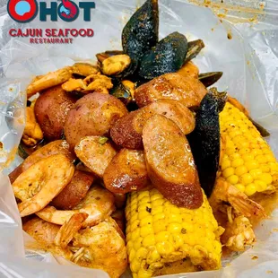 Seafood Boil Bag with Mussels, Shrimp, Sausage, Corn, and Potatoes.