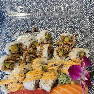 Una Q roll, spicy salmon roll, tuna nigiri, and salmon nigiri