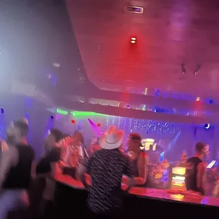 a group of people in a nightclub