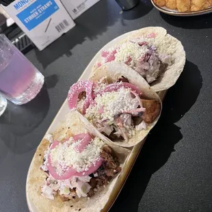 Two chicken and one brisket tacos