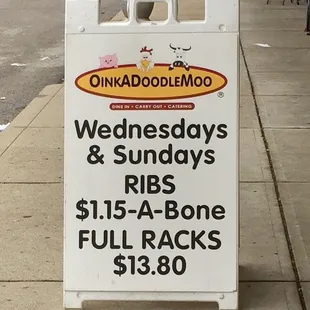 a sign on a sidewalk