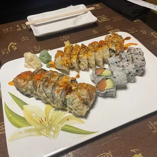 Volcano Roll (left), Godzilla Roll (top middle), and the Salmon Avocado Roll