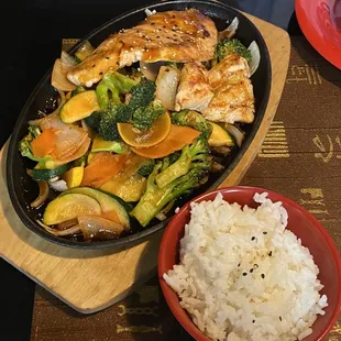 Teriyaki Salmon comes with rice, salad, and soup. Great portion and flavorful. Served hot and crispy!