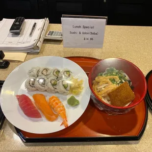a plate of sushi and a cup of coffee