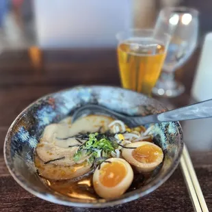 a bowl of ramen and chopsticks