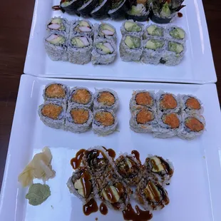 two plates of sushi with sauce