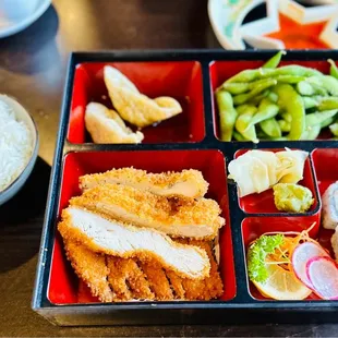 a bento box of food