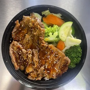 Beef Teriyaki Bowl, steamed veggies, white rice topped with teriyaki sauce.