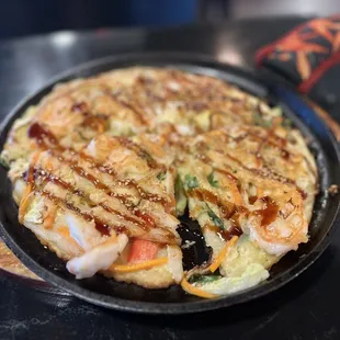 an omelet with shrimp and vegetables