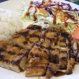 a plate of food with rice and vegetables