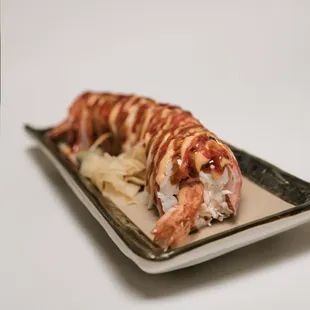 a piece of sushi on a plate