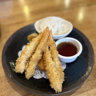 a plate of food with dipping sauce