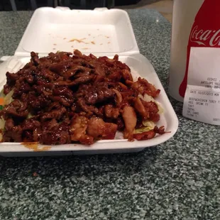 Chicken and beef teriyaki with rice. Medium drink on the side.