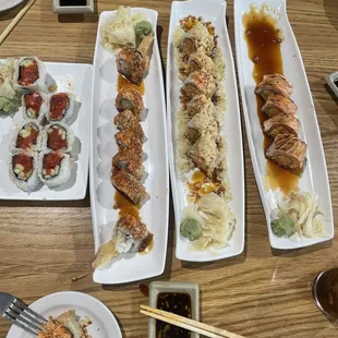 Left to right. 128. Spicy tuna roll, crunch munch, ?, and 228. Cardinal Roll