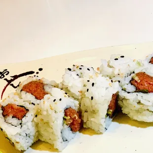 three pieces of sushi on a plate