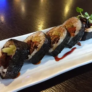 Salmon skin roll. I switched over to this style instead of the hand roll version. More practical and better for sharing:)