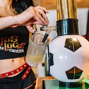 a woman pouring a drink